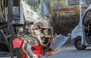 Common bus accident injuries in Kansas portrayed by a bus in a front end accident.